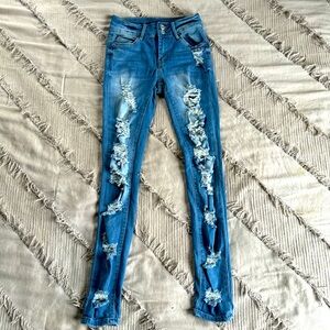 Rue21; size 0 ; ripped dark blue jeans ; worn once
